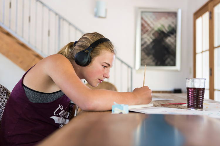 an image of a young girl designing a hoodie design for Dust Off Rinkwear