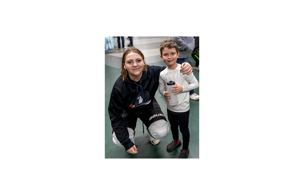 An image of London with a little boy hockey player - Dust Off Rinkwear